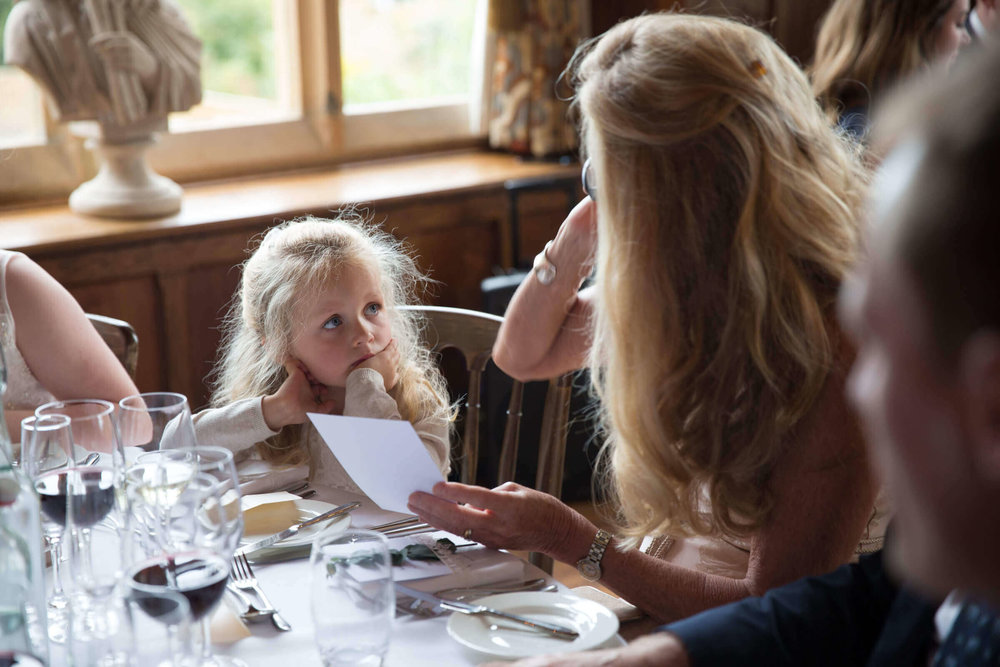 flower girl talking to mother ready for speeches