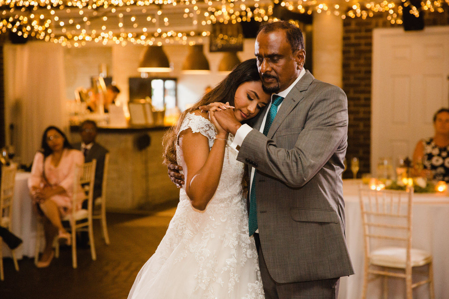 first dance of bride and father sharing intimate moment