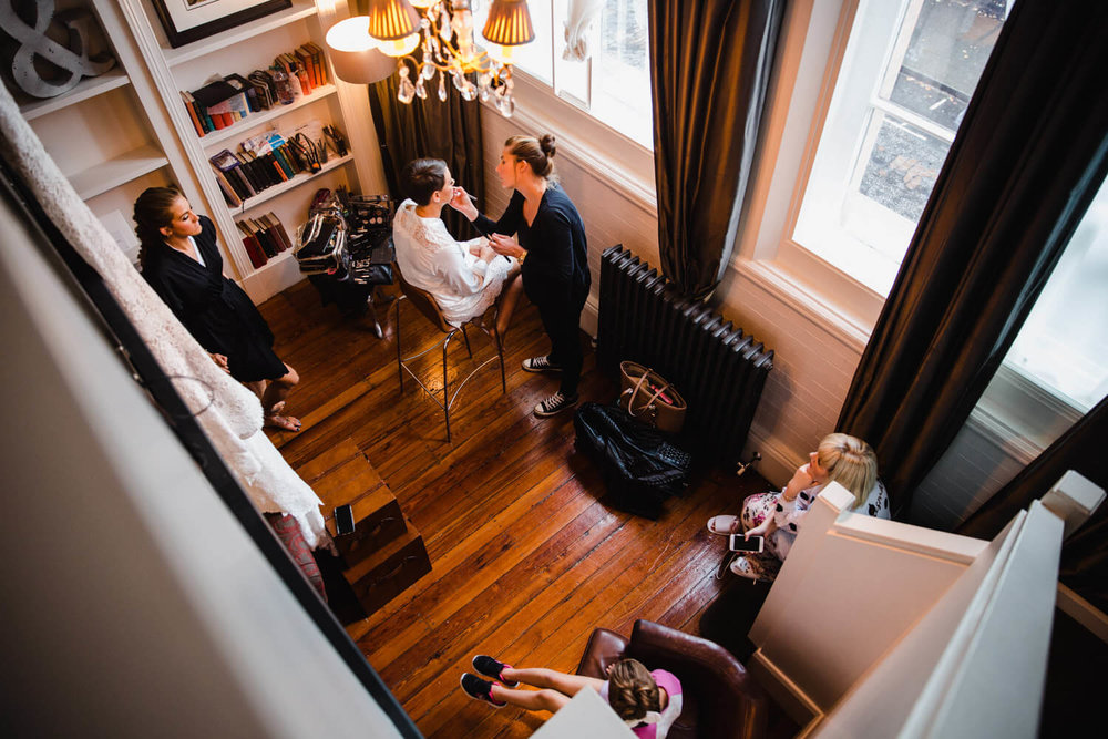 Copy of photograph taken from top of balcony looking down at bridal preparation area