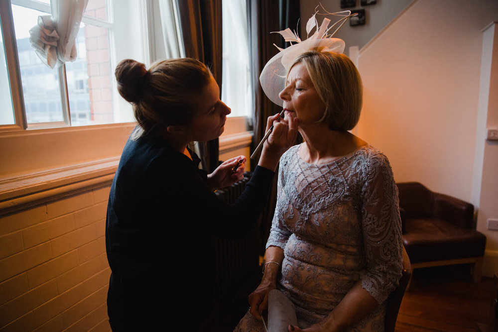 Copy of mother of bride having make up applied before great john street hotel wedding