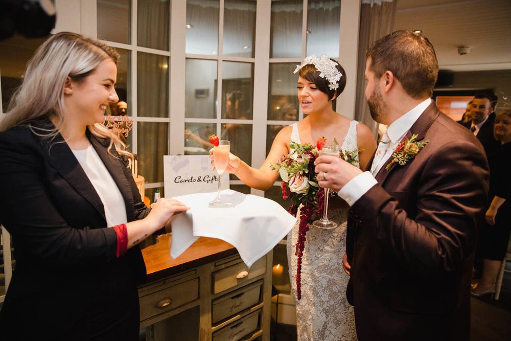 Copy of newlyweds share glass of champagne as celebration to wedding