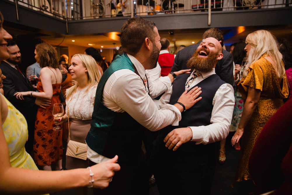 Copy of groom sharing joke about nuptials after great john street hotel ceremony