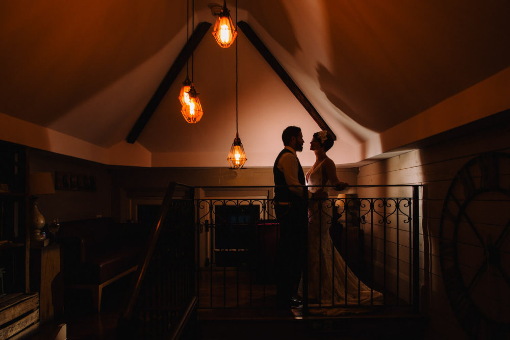 Copy of low exposure flash photography portrait of bride and groom silhouette at Great John Street Hotel