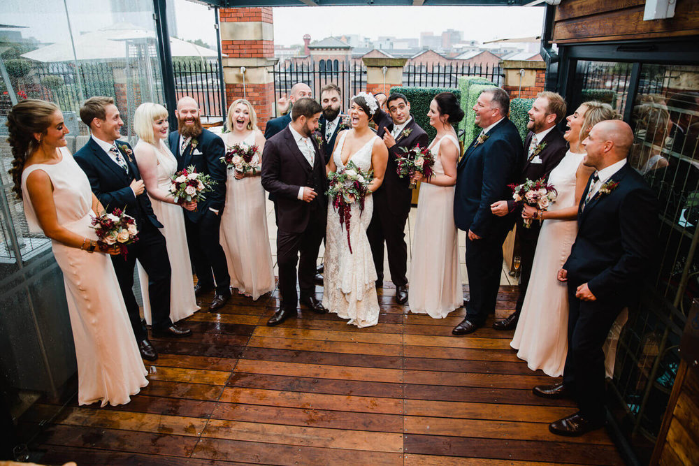 Copy of wedding party all together for group photograph as part of the great john street hotel wedding photography