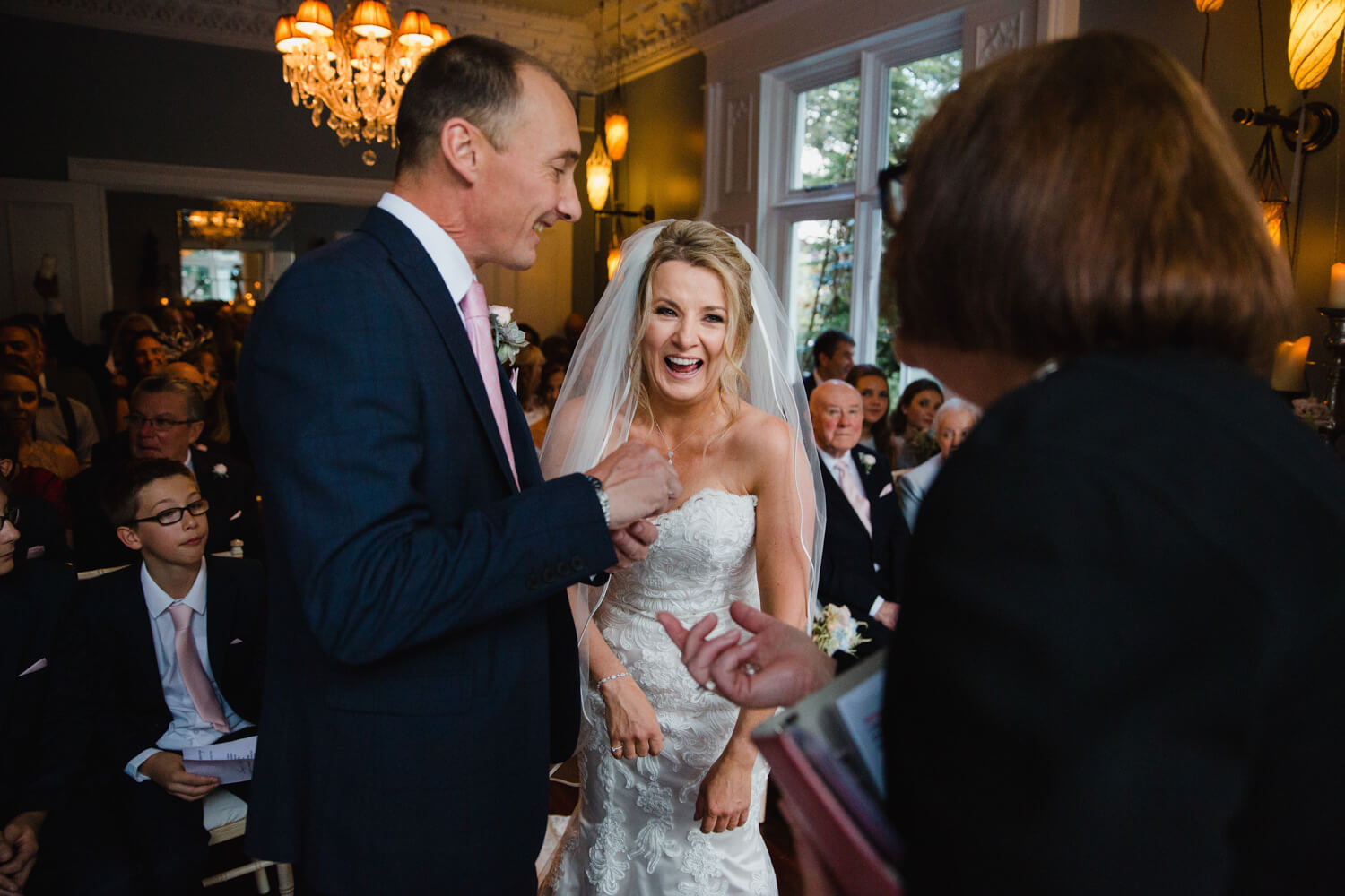 bride sharing joke with registrar during nuptials