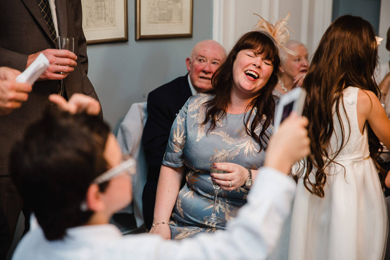 wedding guest laughing at grooms speech