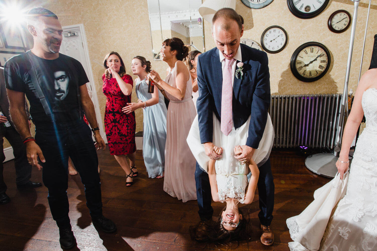 groom dancing with bridesmaid at didsbury house hotel