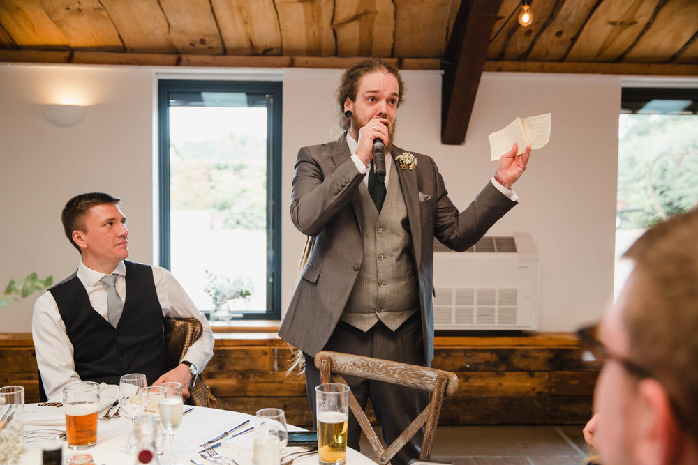 best man giving speech to guests at Owen House Wedding Barn
