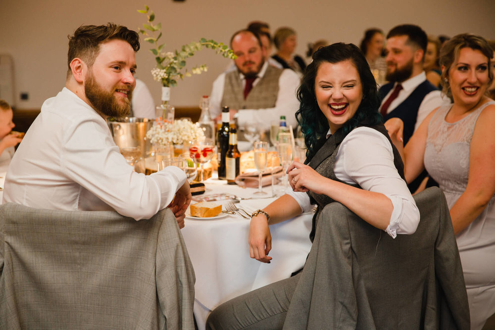 wedding guests laughing at best man speech