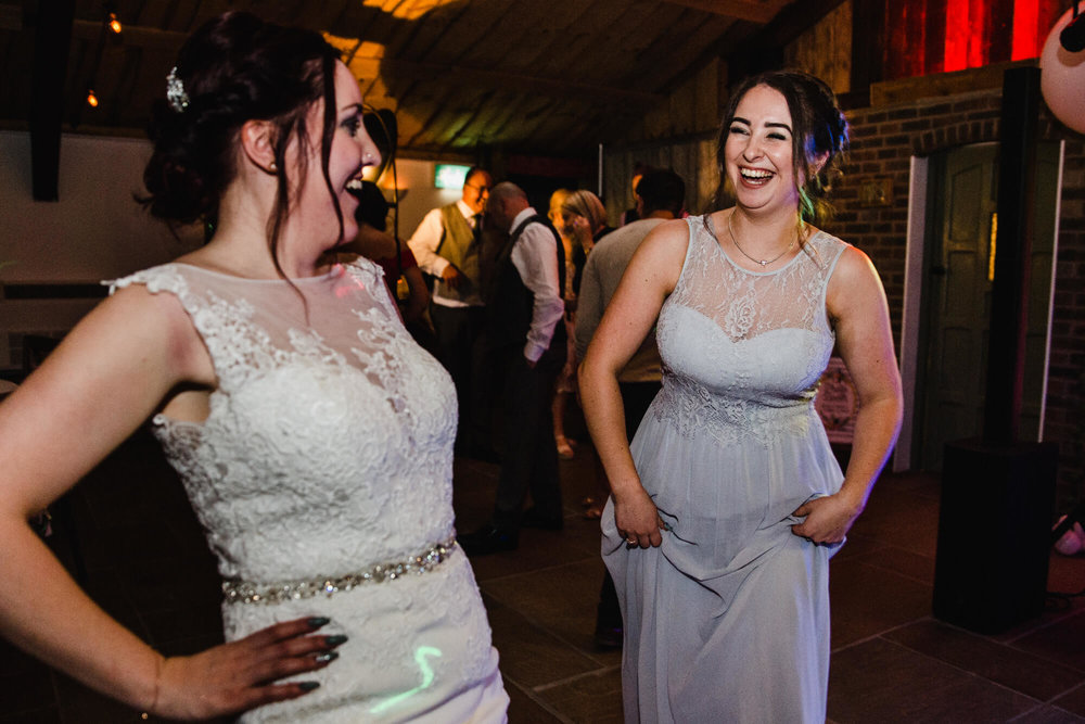 bridesmaids rock out the night at Owen House Wedding Barn