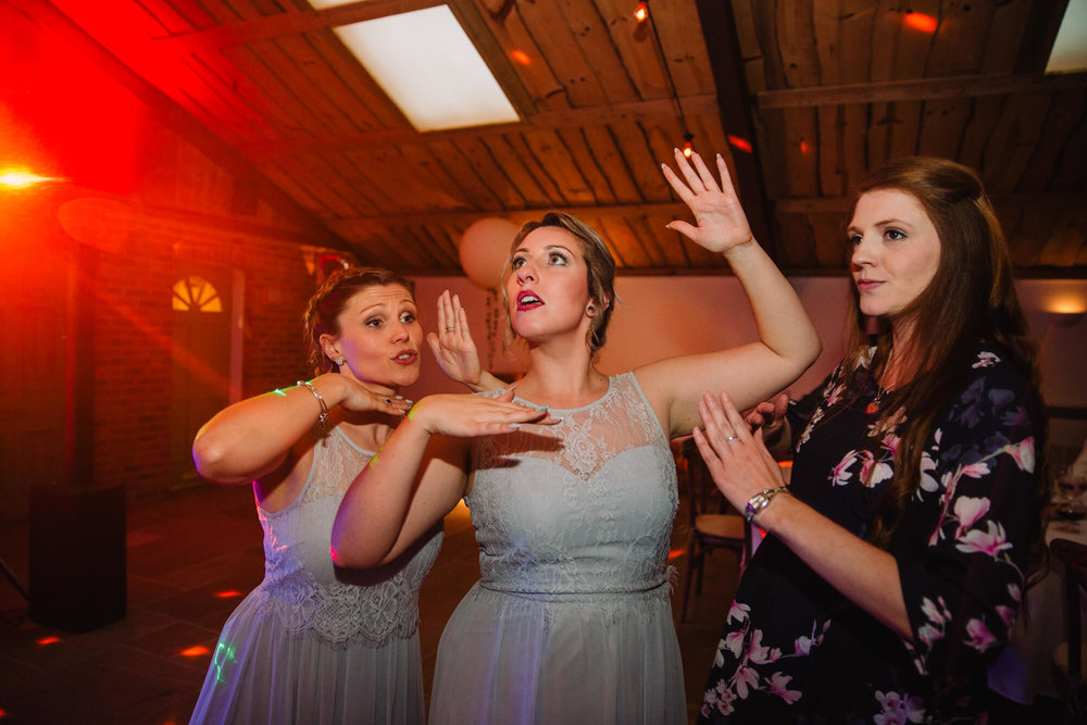 bridesmaids posing and dancing to camera