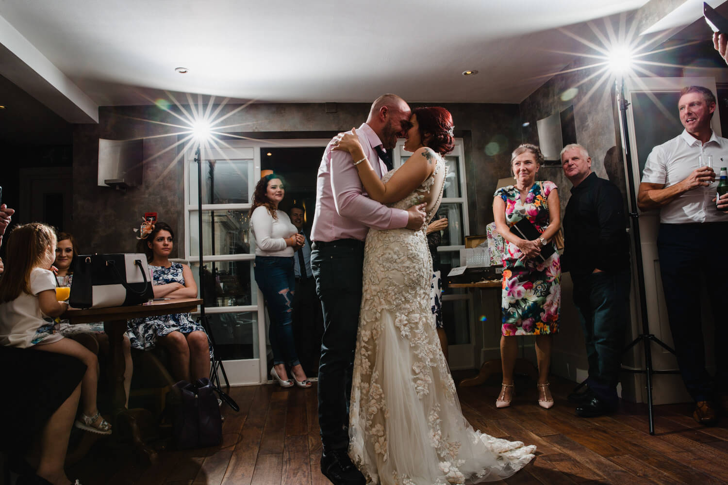 starlit flash exposure for first dance as wedded couple share first dance with friends and family