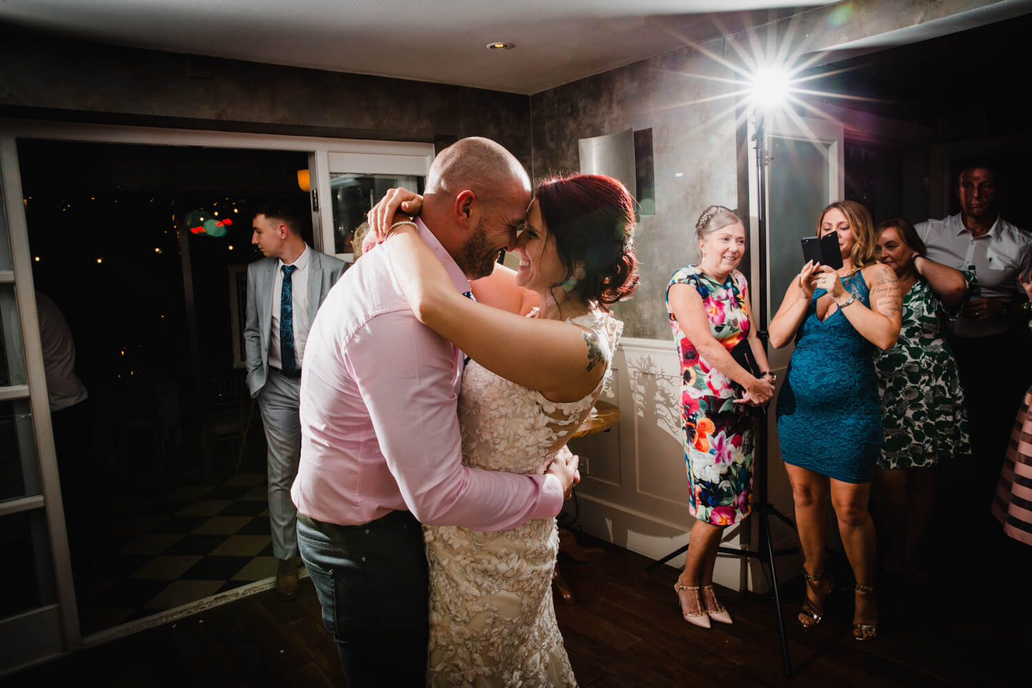 close up photograph of bride and groom together on dance floor
