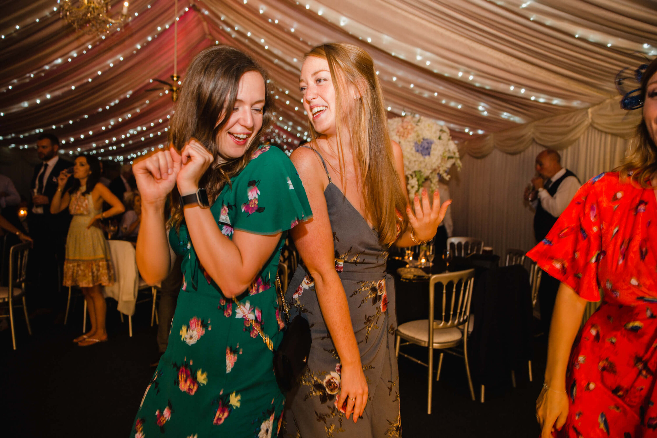 relaxed candid moment caught on camera as guests dance together