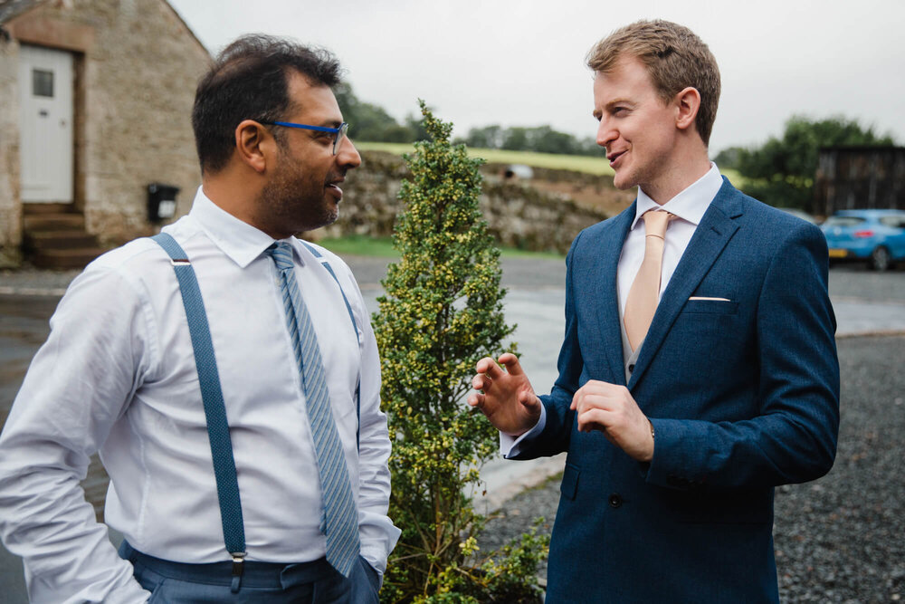 groom shares moment with groomsman before ceremony