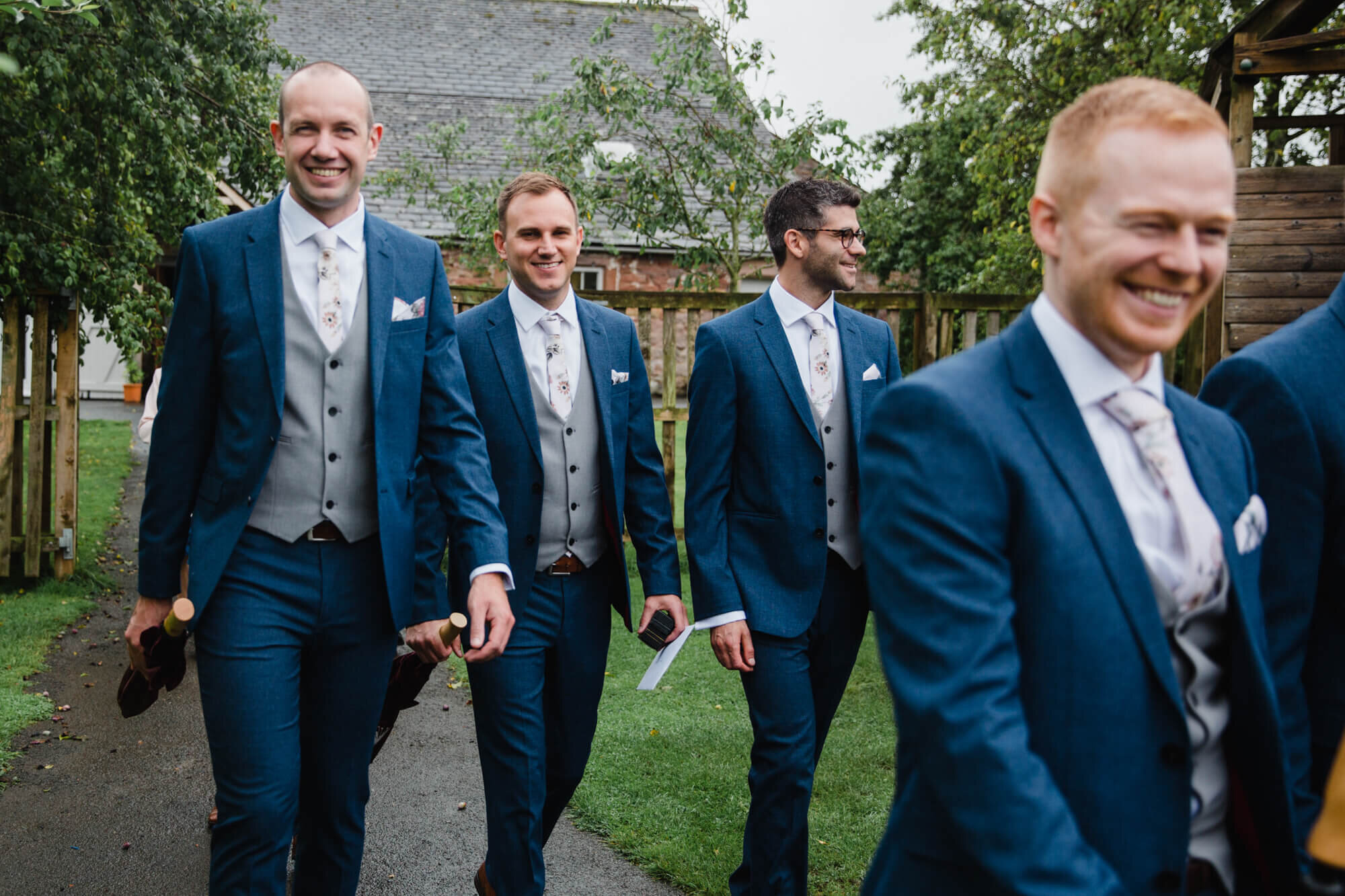 groomsmen smiling into camera