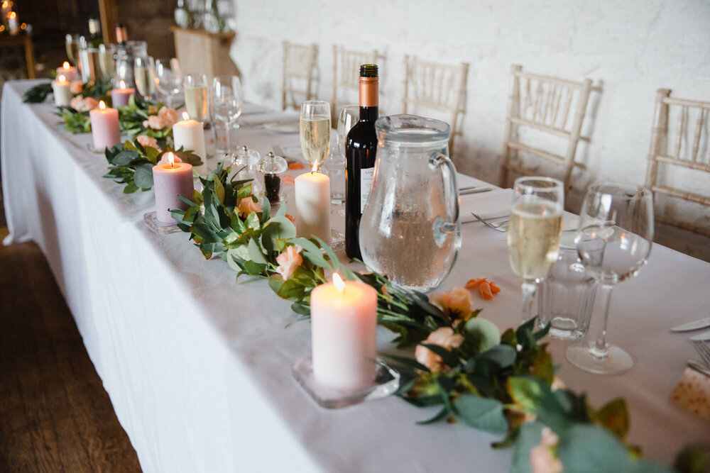 rustic top table setting for champagne drinks glasses and candles