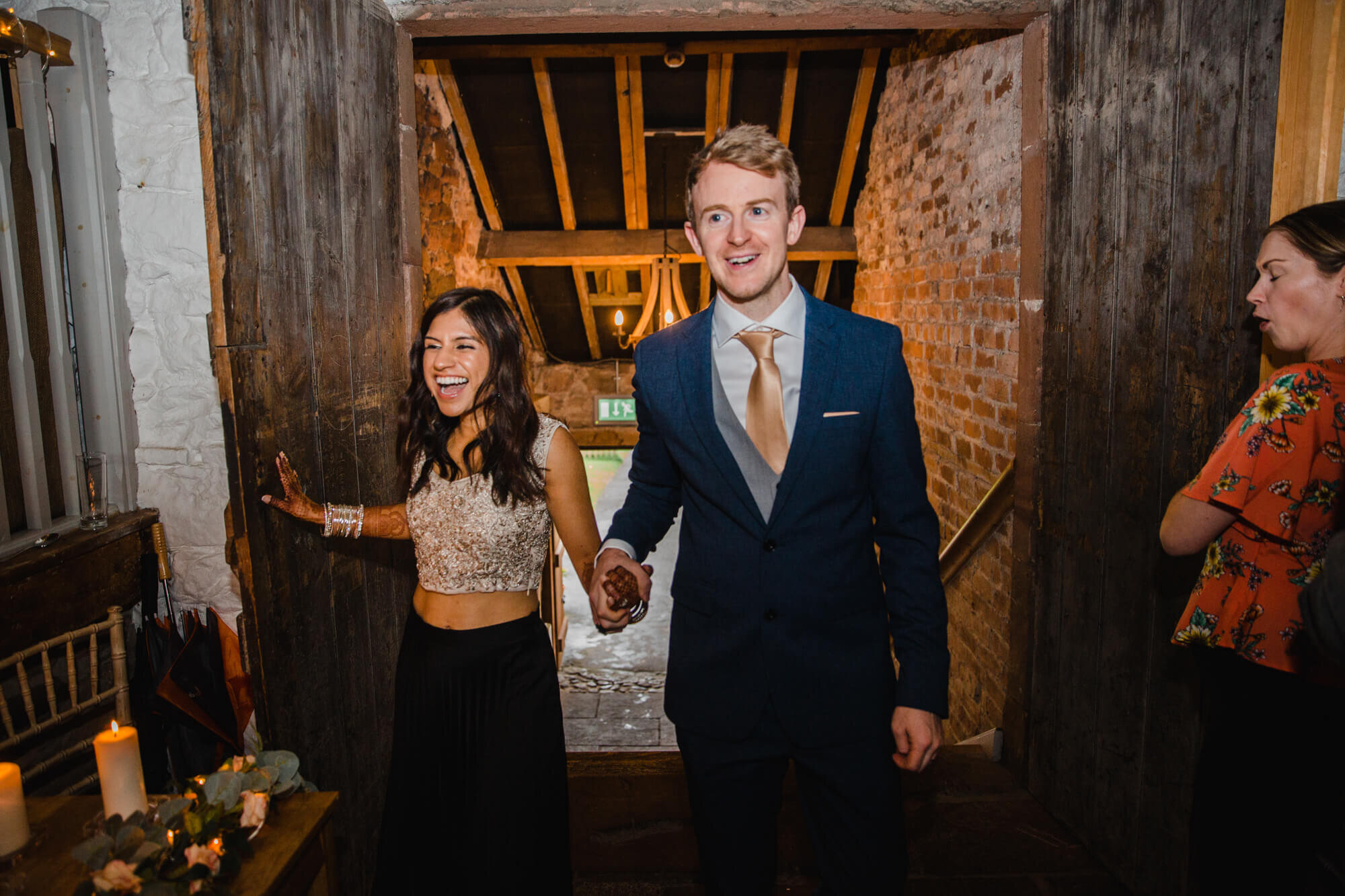 newlyweds enter barn for evening entertainment