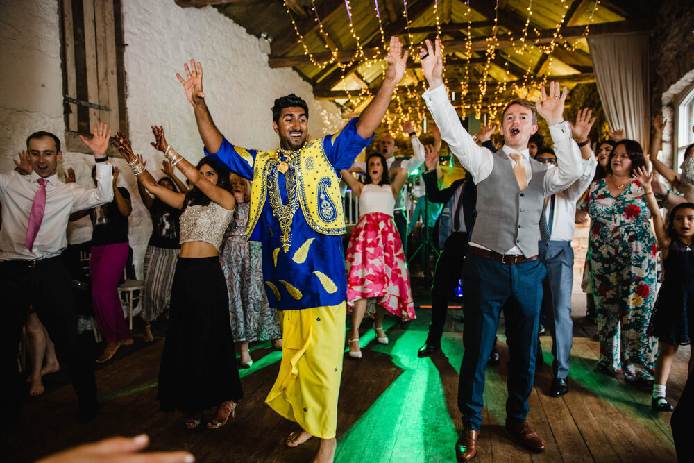 newlyweds and family dancing to music