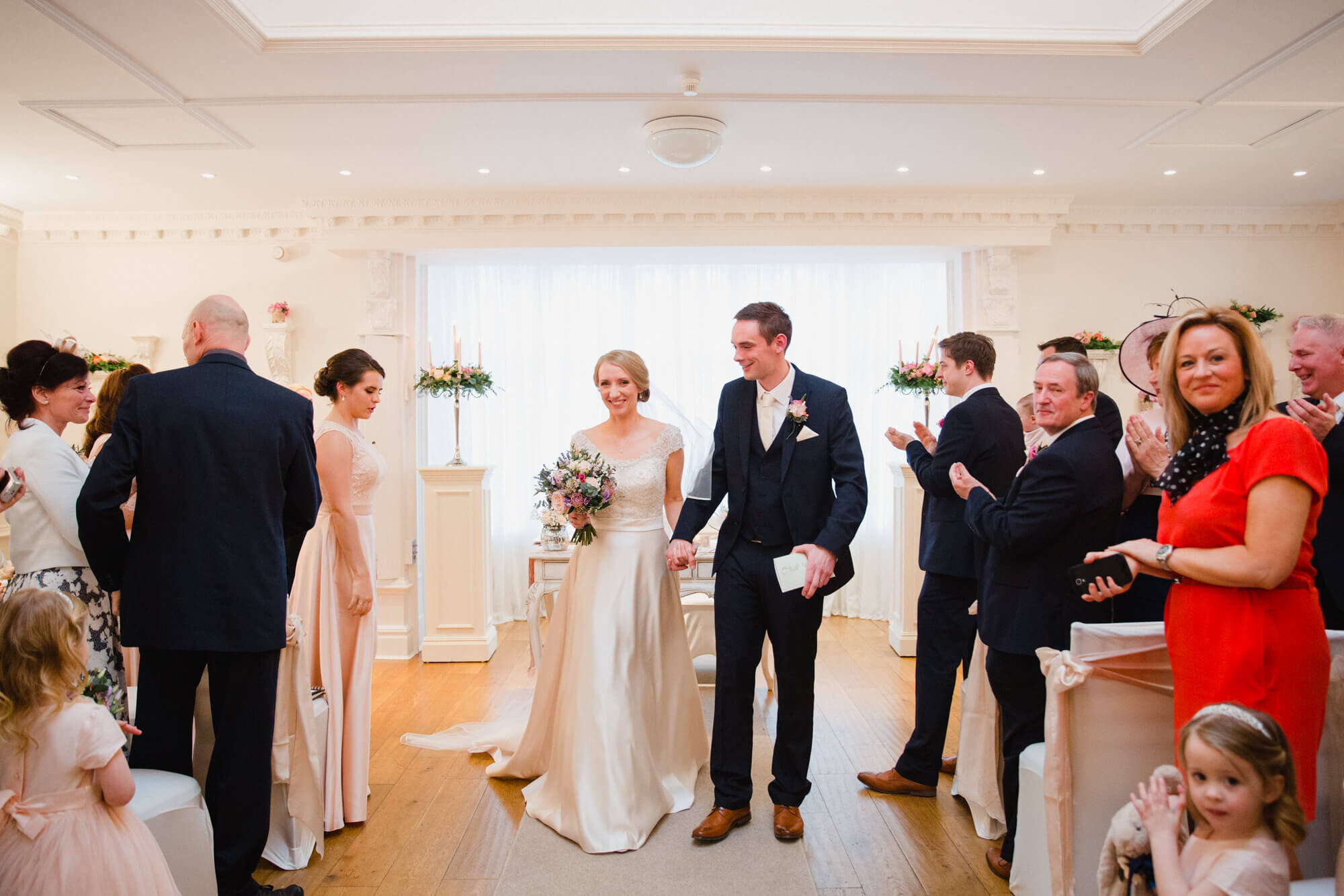 newly wedded bride and groom celebrate being married at Ashfield House