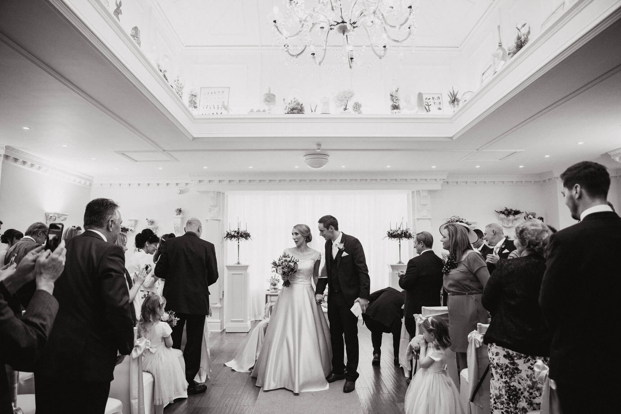 black and white wide angle photograph of wedding processional