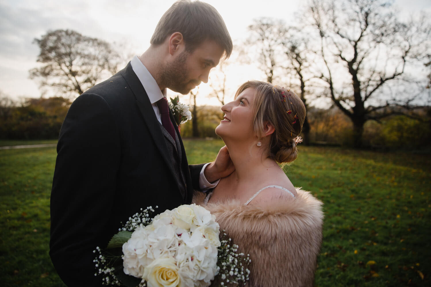 Intimate portrait of newlyweds together at oakwell hall