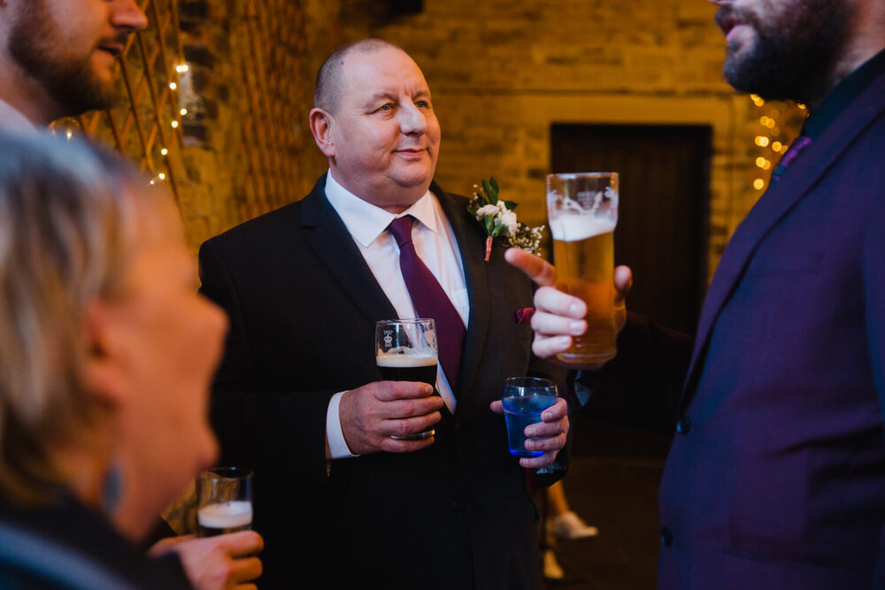 photographs of wedding guests together in reception hall