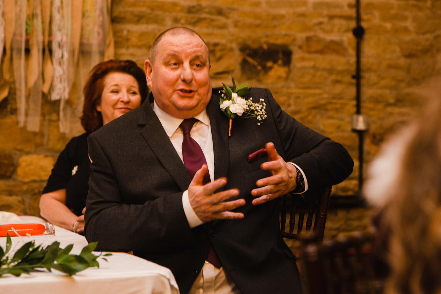 father of bride giving speech to wedding party