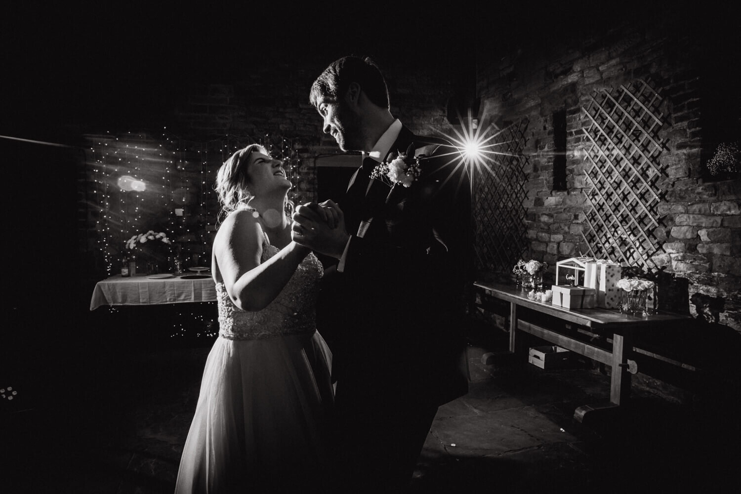 starburst flash photography lights up bride and groom during first dance