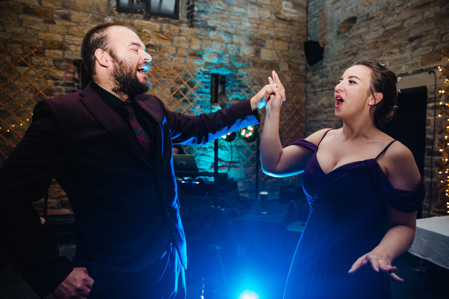 bridesmaid and partner dancing together to music