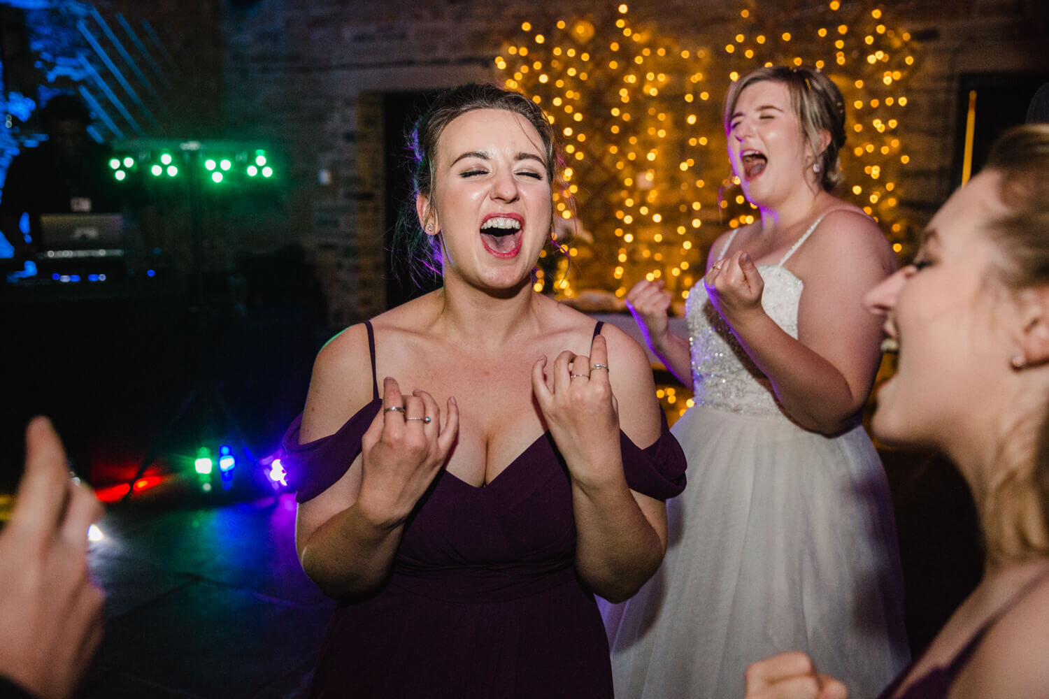 bridesmaids dancing and singing to music