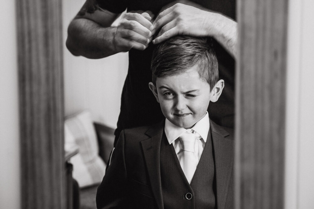 close up shot of page boy having hair brushed