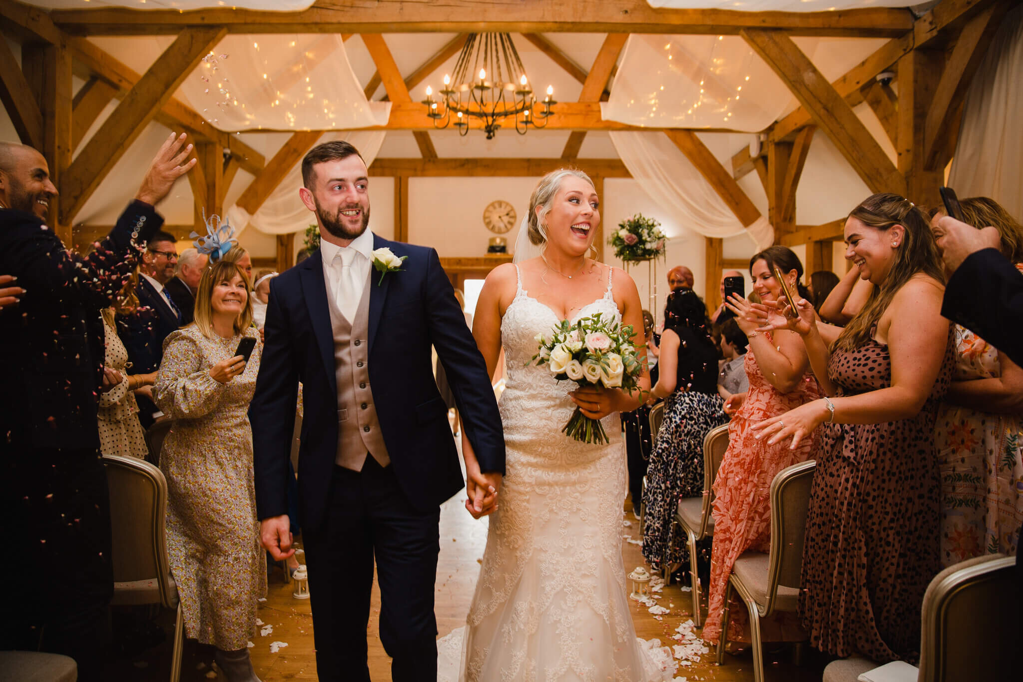 processional in oaken barn with confetti to celebrate