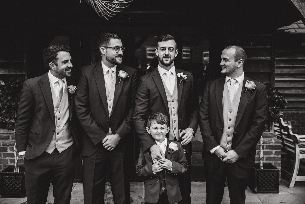 black and white photo of groomsmen quartet after ceremony