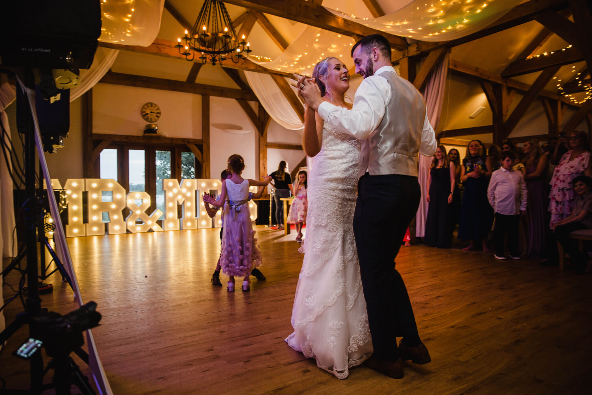 first dance performed in front of set of MR &amp; MRS light up letters