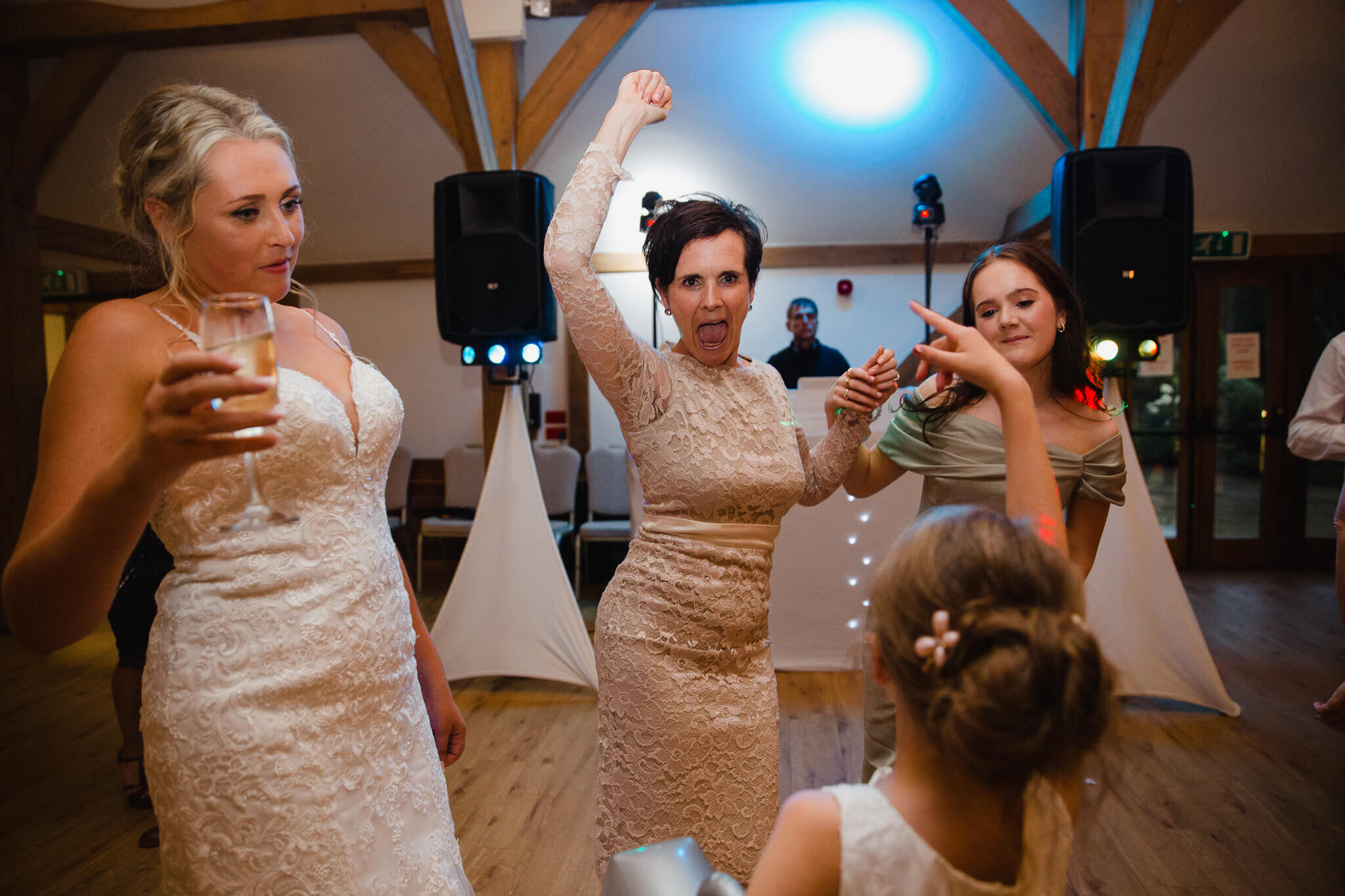 guests celebrate with arms in air