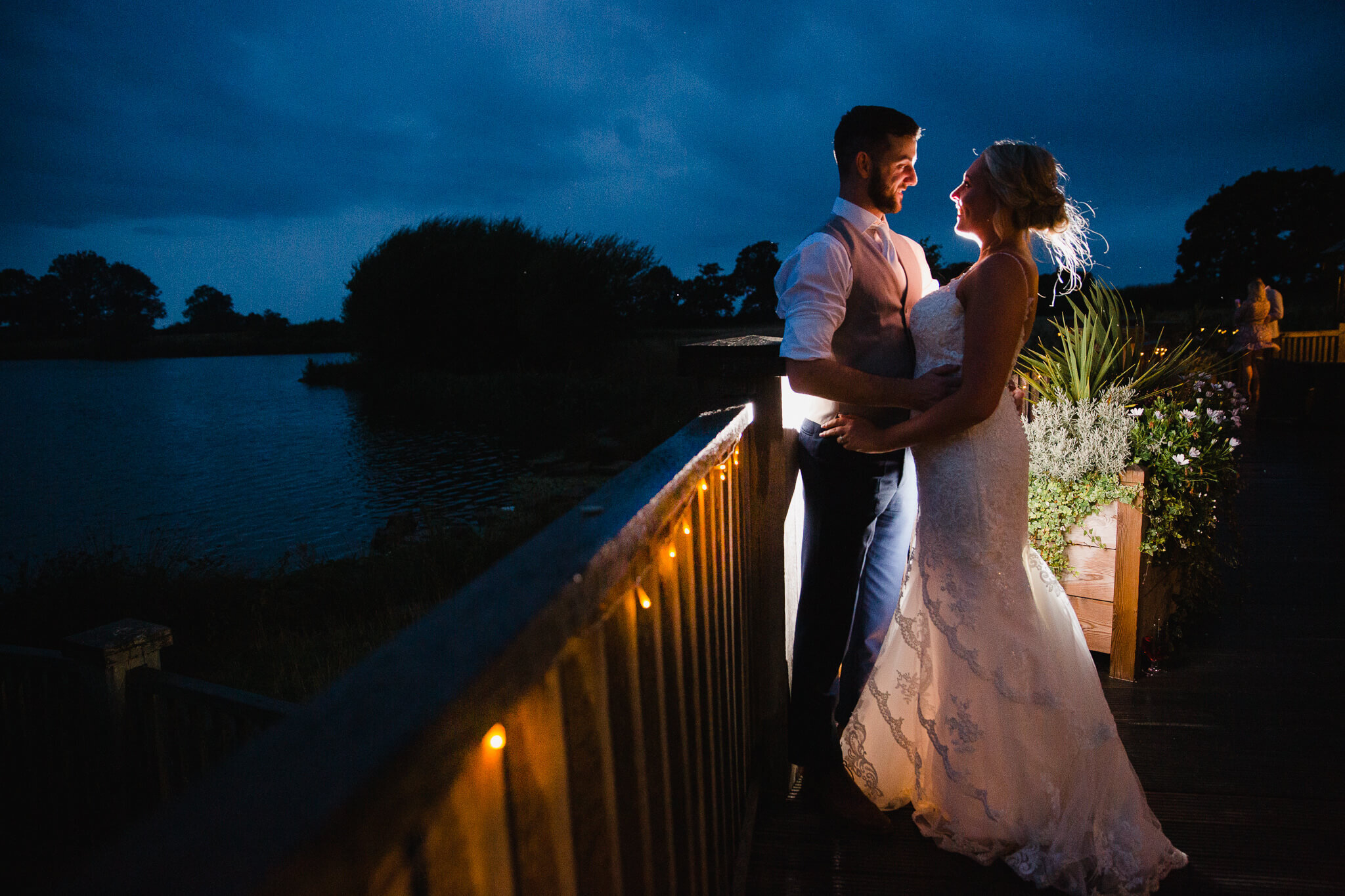 twilight flash kit photograph with low exposure to light up bride and groom