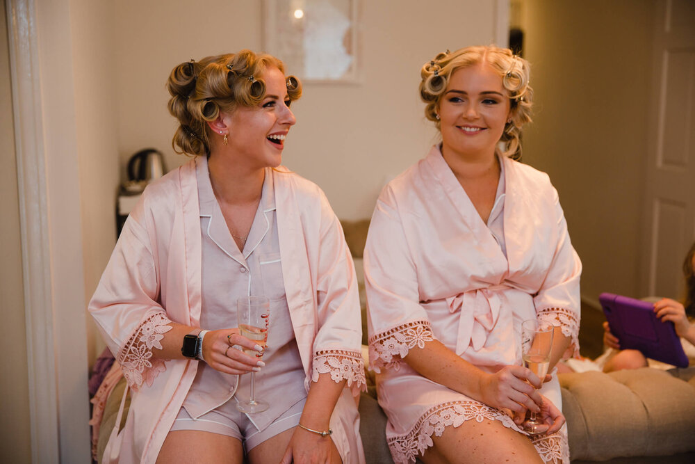 bridesmaids in gown with champagne out and in great spirit!