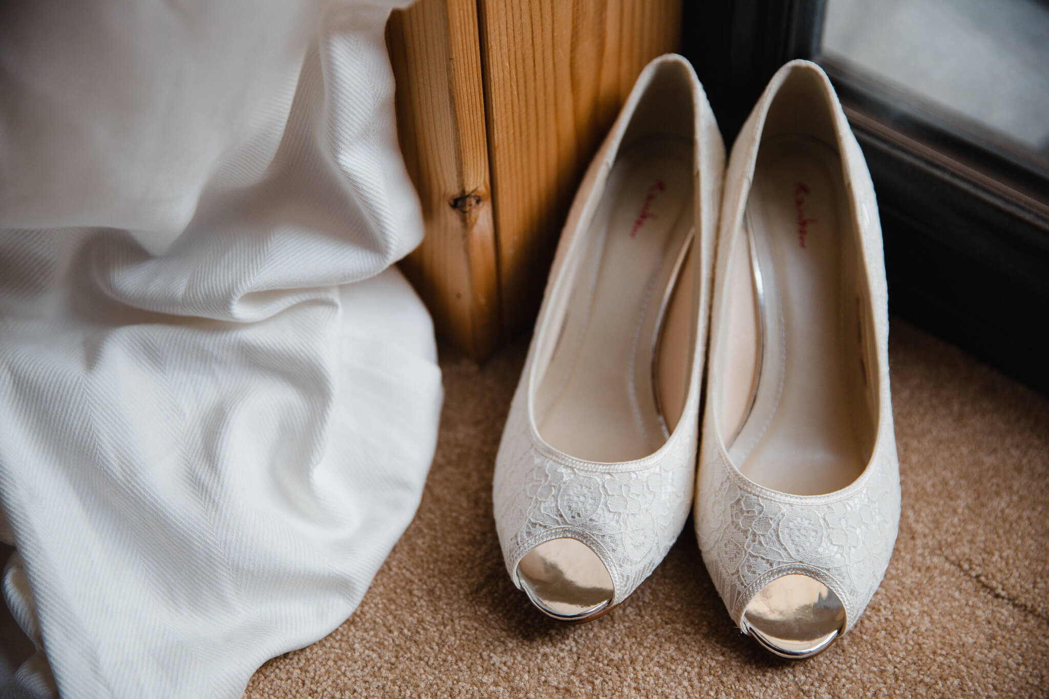 bridal wedding shoes by the window