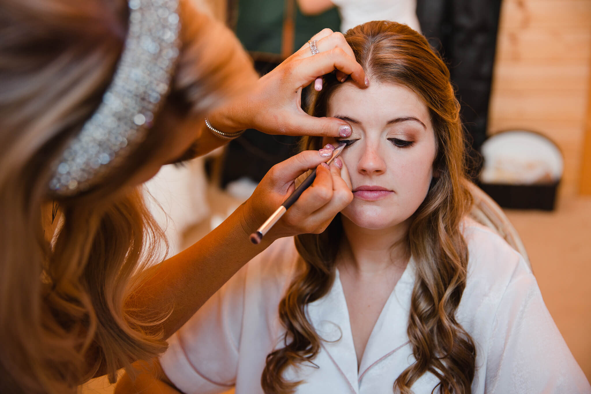bride make up in chair