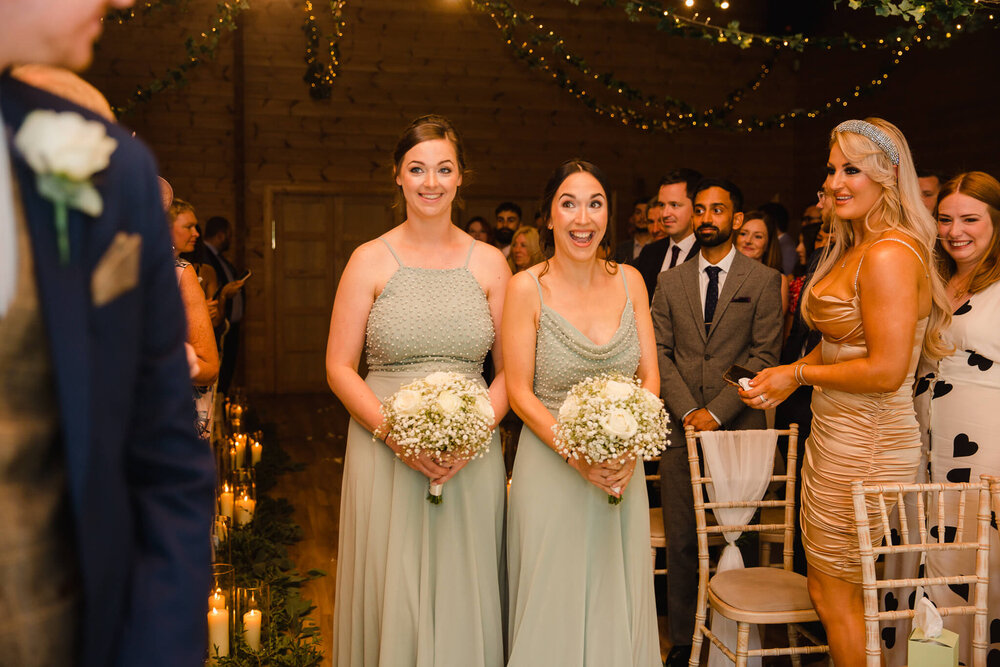 bridesmaid walking down aisle during processional