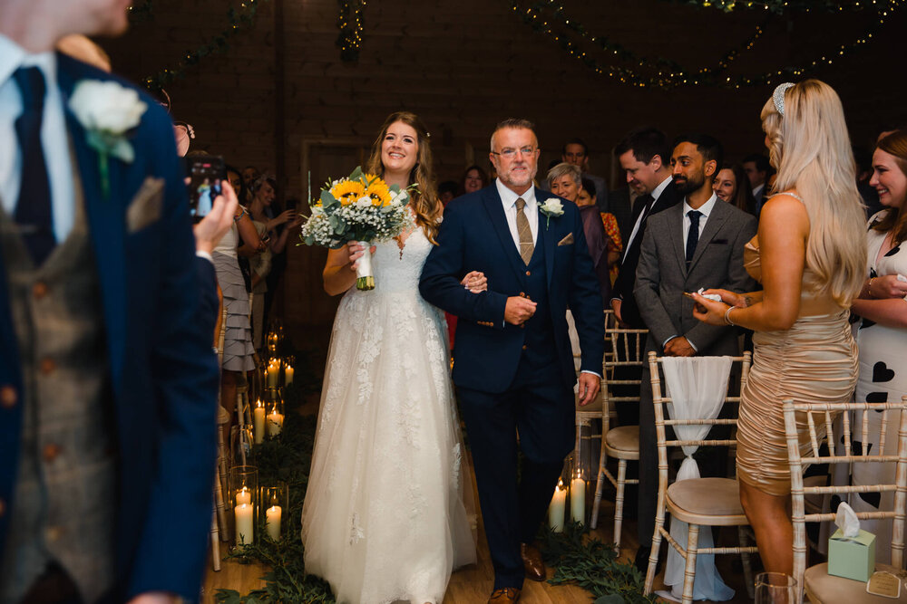 father of bride being very relaxed and reassuring with daughter