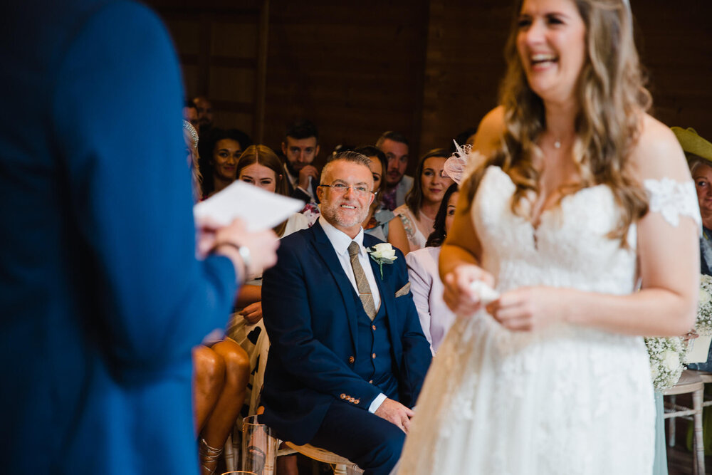 father of bride smiling during service