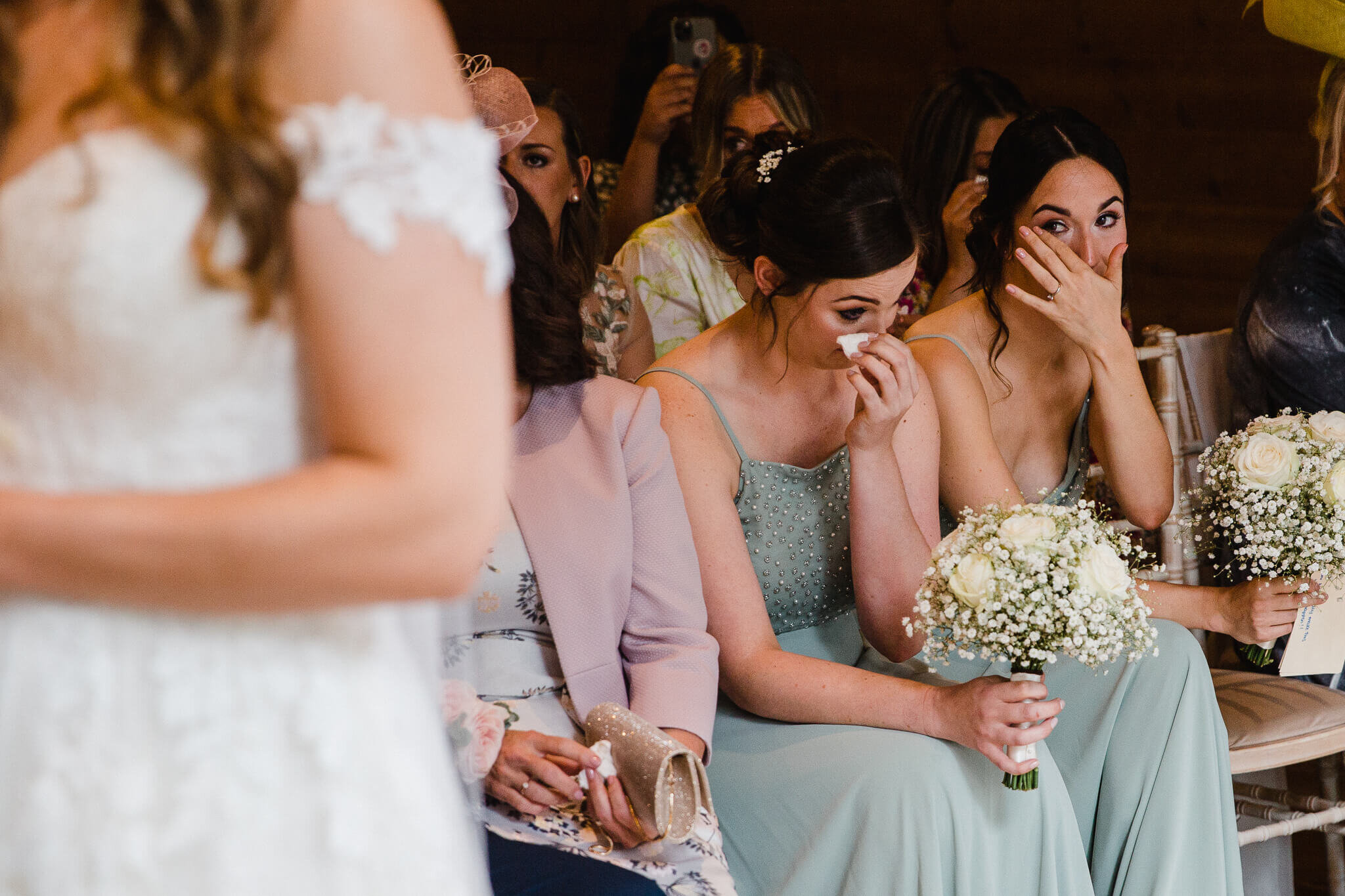 bridesmaids crying during wedding service