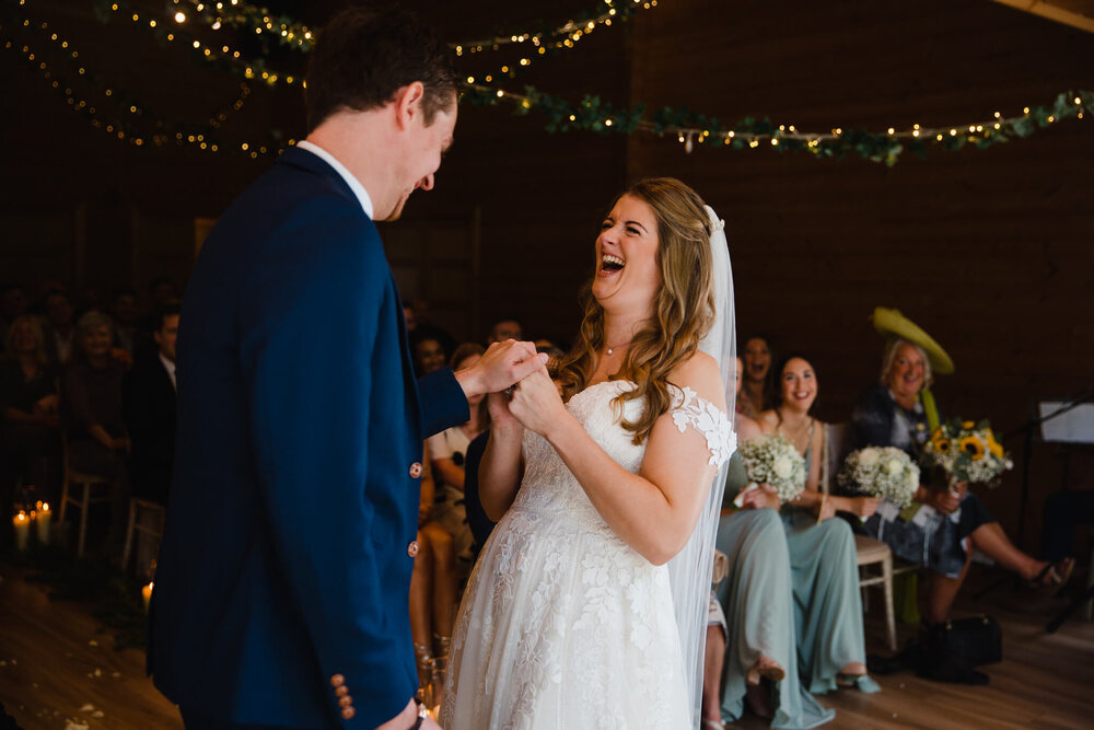 newlyweds laughing and sharing joke