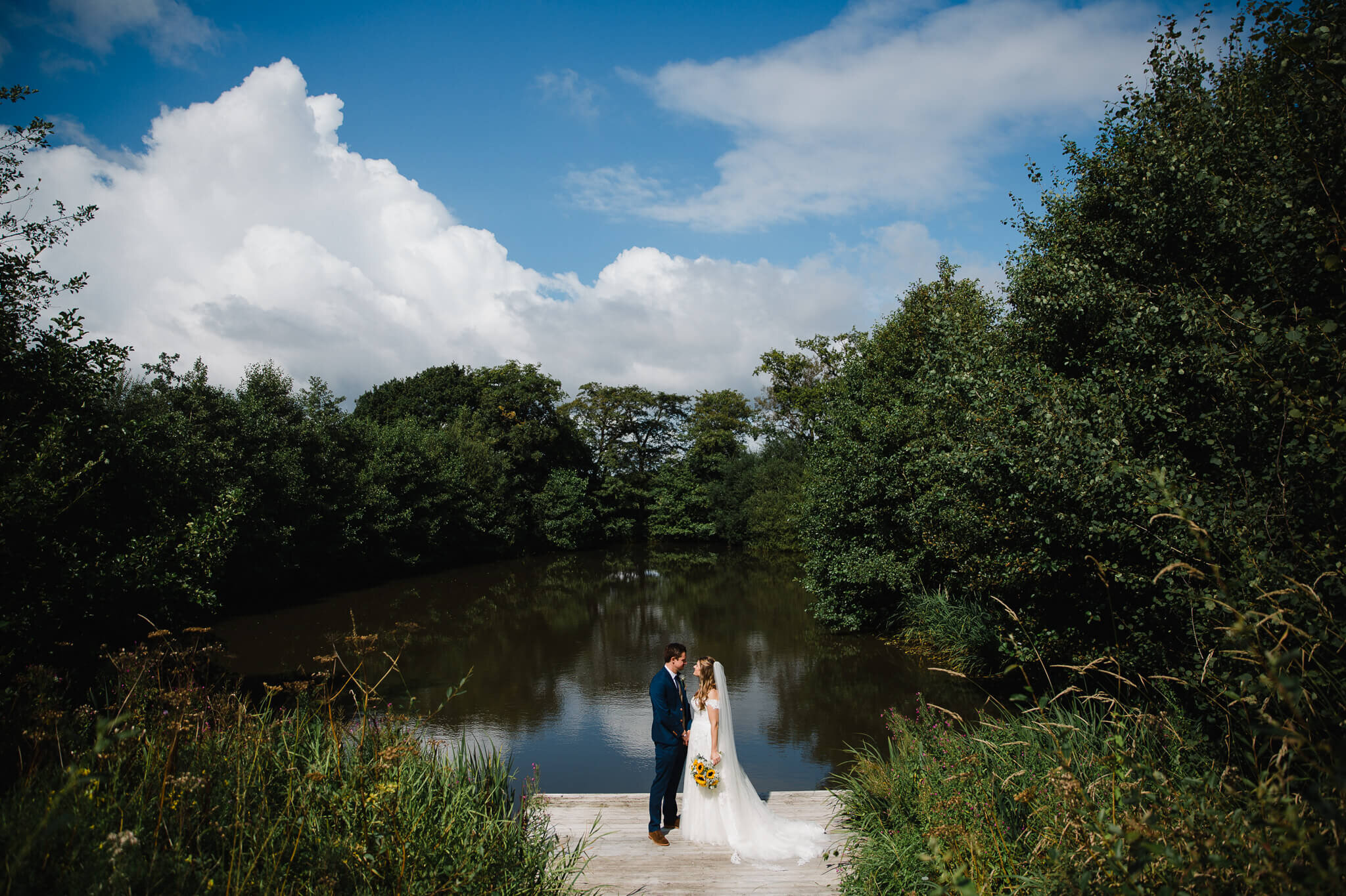 the lake is a lovely areas for portraits for bride and groom