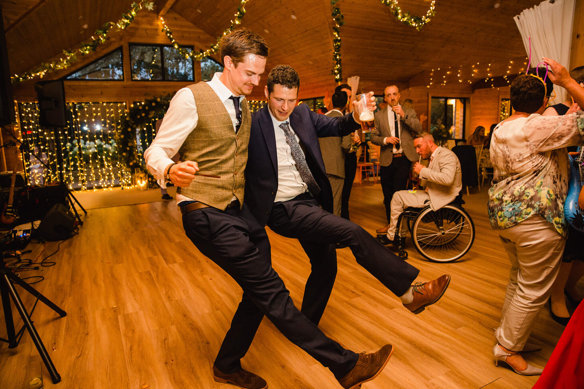 groom and best man dancing together