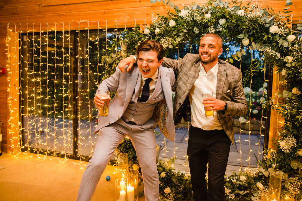 groomsmen dancing to band music