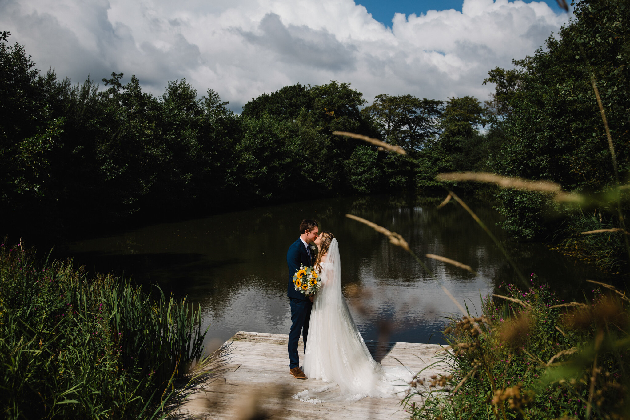 intimate portrait of newlyweds by the lake