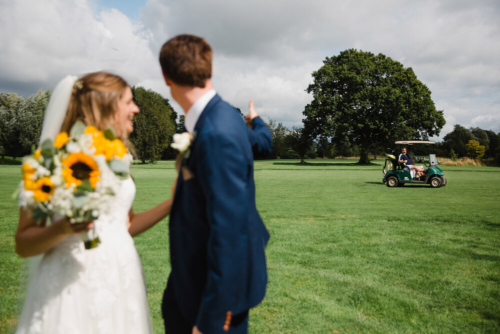 golf club buggy escorting golfers with a wedge